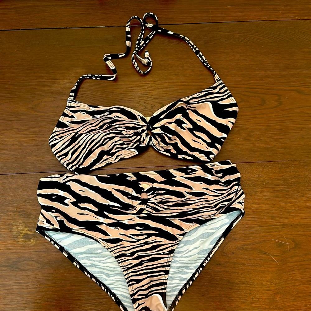Swimsuit has never been worn, but tags have been removed.